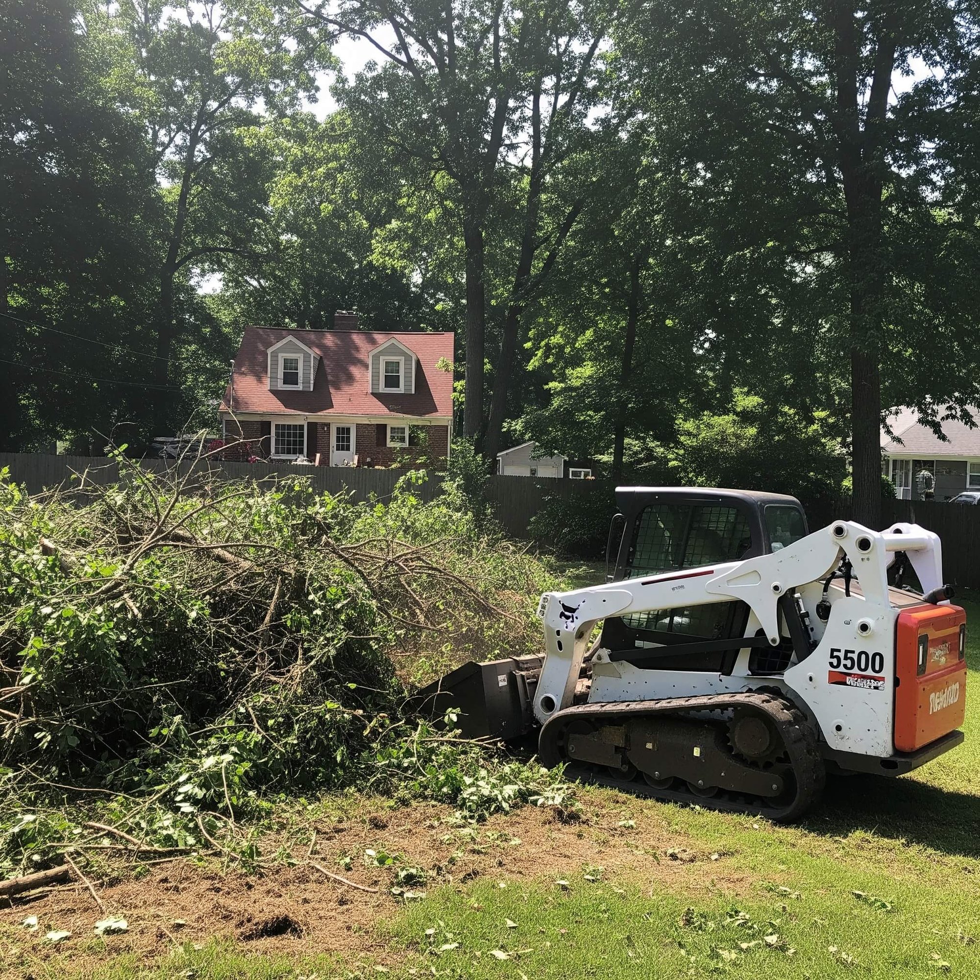 Expert brush removal by skid steer in Huntersville, NC, transforming overgrown Lake Norman area land.